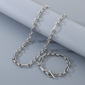 Macro shot of silver titanium steel oval link necklace and bracelet with a T-bar toggle clasp