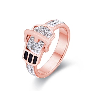 Rose gold belt buckle ring with crystal pavé and black stripe detail on white background