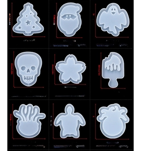 Detailed view of 9 silicone quicksand molds including Christmas tree and octopus shapes
