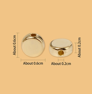 Macro view showing 0.6cm golden CCB round disc spacer beads with dimensions for DIY jewelry