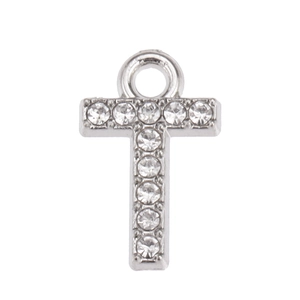 Macro shot of silver letter T pendant with shimmering rhinestones for DIY jewelry