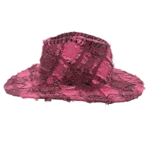 Close-up of pink patchwork cowboy hat with distressed frayed edges and stitching details