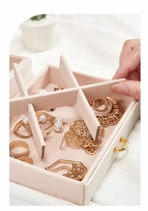 Detail of adjustable dividers in white jewelry box with soft pink velvet lining