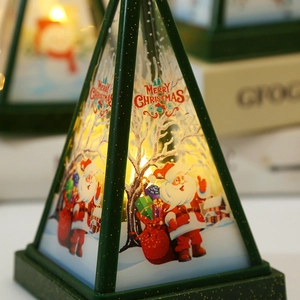 Christmas triangular lantern with Santa illustration and warm yellow LED light decor