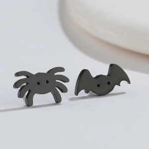 Asymmetric black bat and spider stud earrings for Halloween in minimalist design