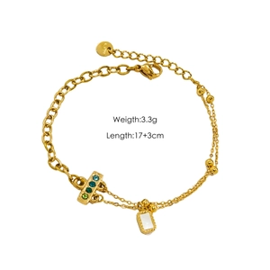 Detail view of a gold-layered titanium bracelet with gemstones, weighing 3.3g and 17+3cm long
