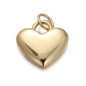 Detailed view of heart-shaped gold-plated pendant with polished finish and bail