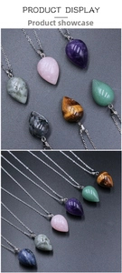 Macro display of teardrop natural stone pendants in amethyst, quartz and tiger eye