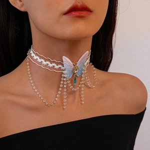 Detail of white lace choker necklace featuring a blue gradient butterfly and crystal tassels