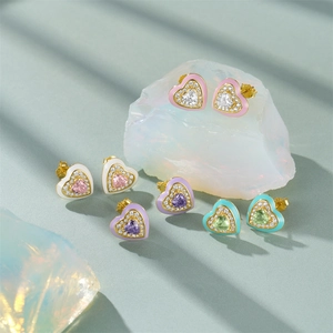 Detail of heart enamel stud earrings with colorful gemstones and micro-pave crystals