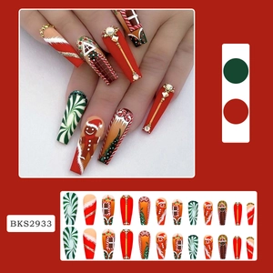 Detail of Christmas coffin press-on nails with gingerbread man and 3D rhinestone art