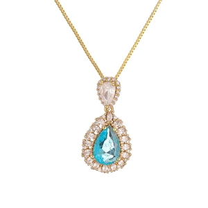Luxury gold necklace featuring a double heart drop pendant with blue pear-shaped crystal