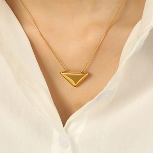 Minimalist 18k gold plated necklace featuring solid triangle pendant on snake chain