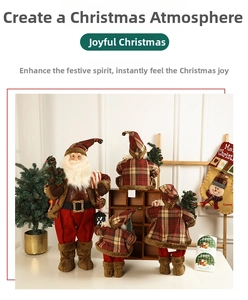 Detail of red and plaid Santa Claus dolls with Merry Christmas stocking and mini tree