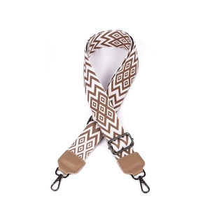 Detail of adjustable 38mm ethnic geometric diamond strap with brown leather and gunmetal hooks