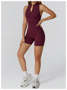 Detailed view of the burgundy yoga bodysuit with a functional front zipper design
