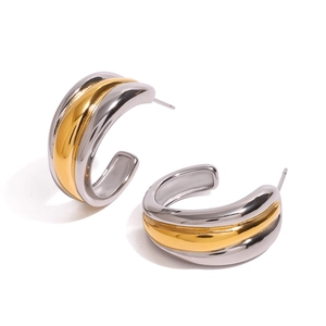 Minimalist two-tone C-shaped hoop earrings in gold and silver stainless steel