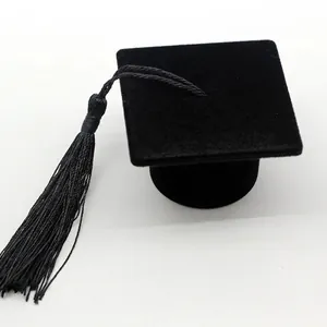 Miniature graduation cap gift box in black velvet finish with delicate tassel accessory