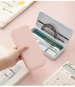 Detail of pink and blue DIY pencil box showing internal compartments and stationery storage