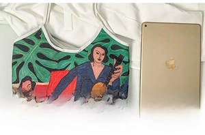 Artistic canvas tote bag size comparison with an iPad showing large capacity
