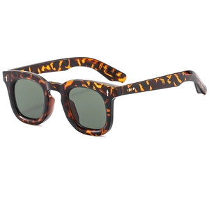 Vintage tortoiseshell round frame sunglasses with silver rivets and dark green lenses
