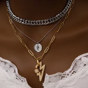 Triple layer necklace with silver coin portrait pendant and gold zircon lightning charm