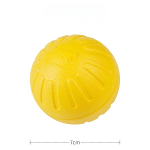 Detail showing a 7cm solid rubber dog ball toy with durable textured surface for chewing
