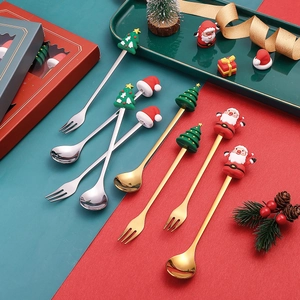 Christmas stainless steel cutlery set with Santa and tree motifs in festive gift box