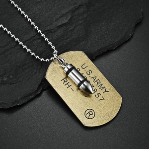 Detailed shot of U.S. Army dog tag and bullet pendant necklace on black stone base