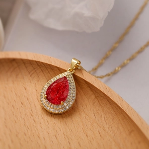 Elegant gold-plated waterdrop necklace with a red stone and white zircon stones