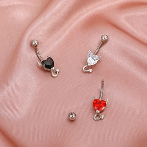 Fashion heart zircon belly button rings with devil horns and tails on pink silk fabric
