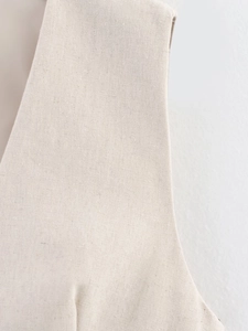 Detailed close-up of premium beige linen blend fabric texture for sleeveless summer set