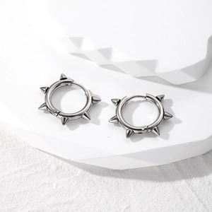 Punk style stainless steel hoop earrings with spiked rivet studs for a hip hop look