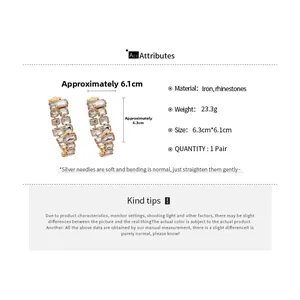 Detail view of large geometric rhinestone hoop earrings with precise size measurements