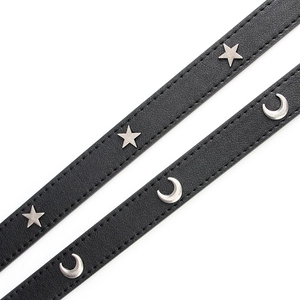 Punk style black leather belts featuring silver star and crescent moon metal rivets