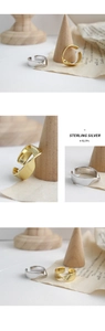 Detail showing S925 hallmark on polished sterling silver Mobius twisted open ring