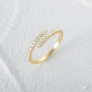 Macro shot of an adjustable S925 sterling silver ring with shimmering gold cubic zirconia