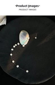 Detail showing natural iridescent shell piece and rows of delicate freshwater pearls