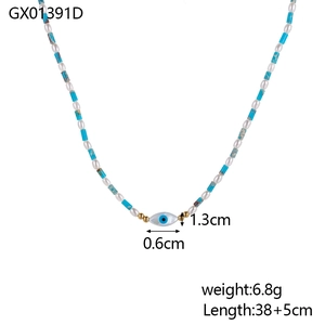 Beaded necklace with blue cylinders, white ovals and evil eye pendant in trendy style