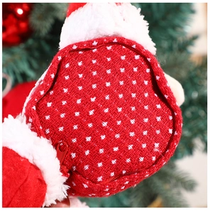 Close-up of red Christmas gift bag showing texture, white plush trim, and zipper detail