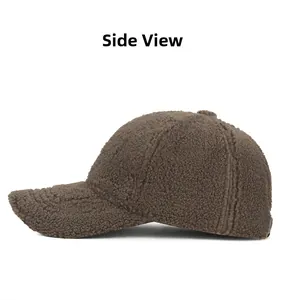 Side view detail of a brown lamb wool baseball cap showing warm fleece texture