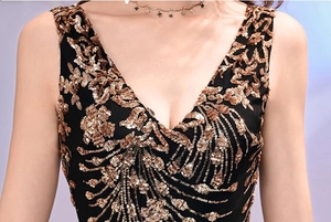 Detailed close-up of golden sequins on a V-neck black sleeveless evening gown