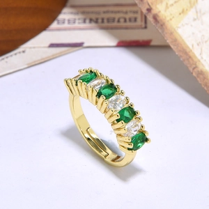 Adjustable gold ring with green marquise stones and white zircons in a 45-degree angle view