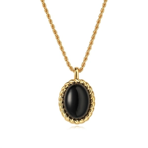 French vintage necklace featuring a black oval onyx pendant with golden rope chain border