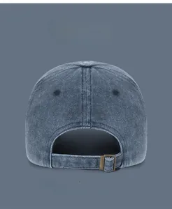 Macro shot of washed cotton baseball cap with vintage metal buckle adjustment back