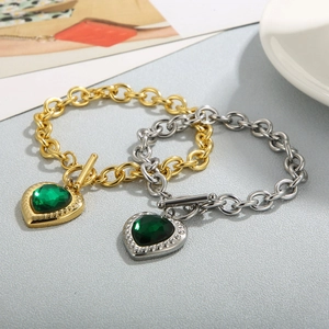 Golden and silver OT buckle stainless steel bracelets with green heart-shaped gemstones
