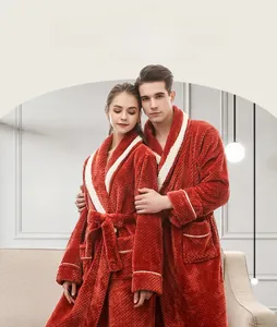 Detail of thick flannel bathrobe featuring dark red pineapple lattice texture and plush fabric