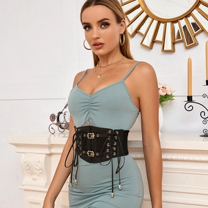 Detail of black lace-up corset belt with double buckles on light blue dress