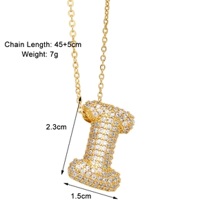 Detail of Letter I pendant with zirconia inlay, golden finish and 45+5cm chain size