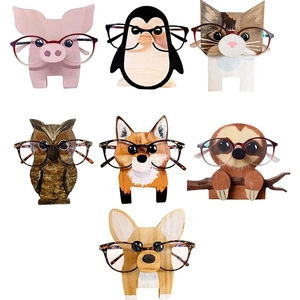 Detailed collage of seven unique wooden animal shaped eyeglass stands on white background